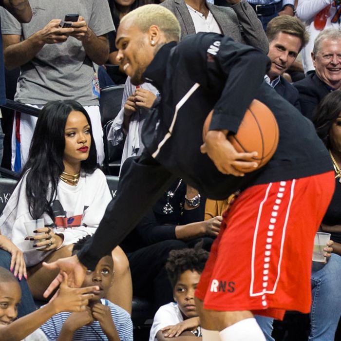 Rihanna Sits Courtside As Chris Brown Plays In Charity Basketball